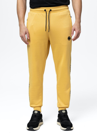 Spodnie dresowe PIT BULL OLDSCHOOL TAPE LOGO TERRY pale yellow