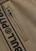 Spodnie dresowe PIT BULL OLDSCHOOL TAPE LOGO TERRY coyote brown