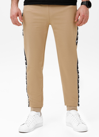 Spodnie sportowe PIT BULL Tricot Terry TAPE NUGGET beżowe (pale sand)
