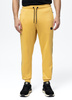 Spodnie dresowe PIT BULL OLDSCHOOL TAPE LOGO TERRY pale yellow