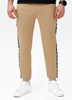 Spodnie sportowe PIT BULL Tricot Terry TAPE NUGGET beżowe (pale sand)
