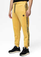 Spodnie dresowe PIT BULL OLDSCHOOL TAPE LOGO TERRY żółte (pale yellow)